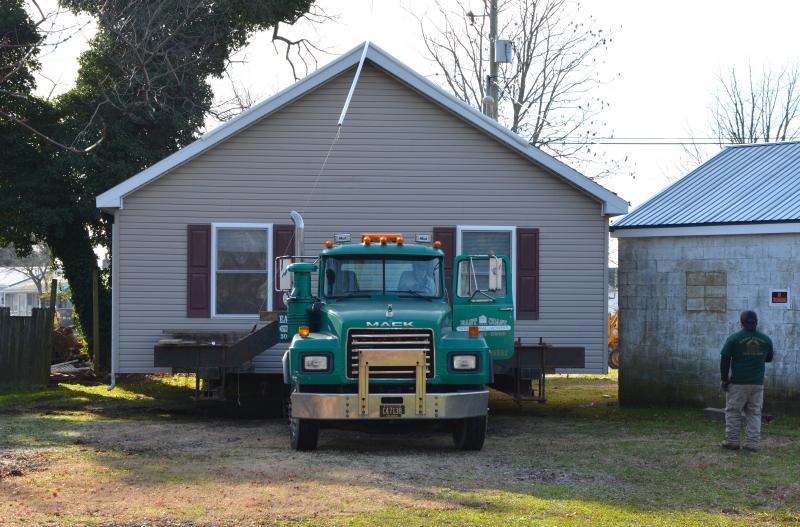 With the help of his crew at every corner, John Davidson, East Coast Structural Movers owner, just clears the corner of what used to be the 400 Club in West Rehoboth. CHRIS FLOOD PHOTOS